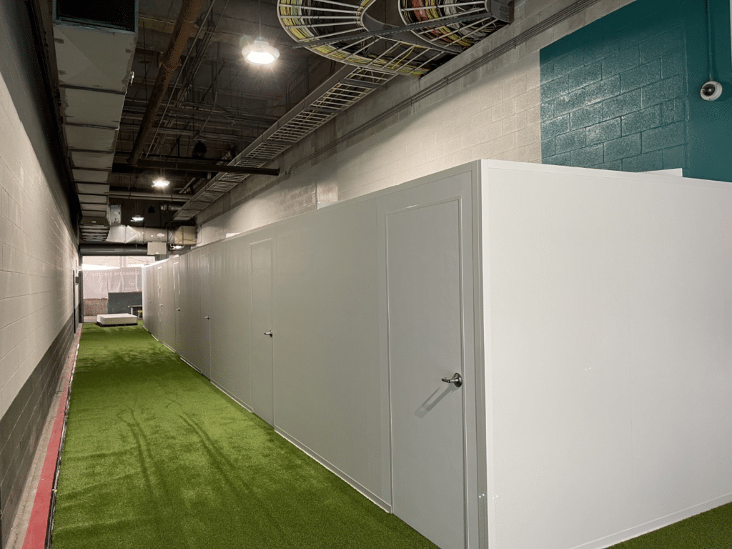 an image showing a modular wall system in the hallway of a golf facility