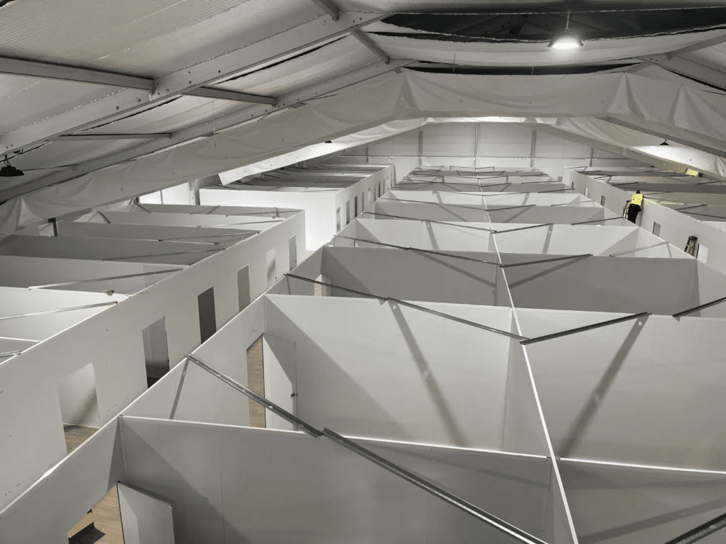 Image of what a temporary refugee camp set-up could be using SwiftWall modular wall systems.